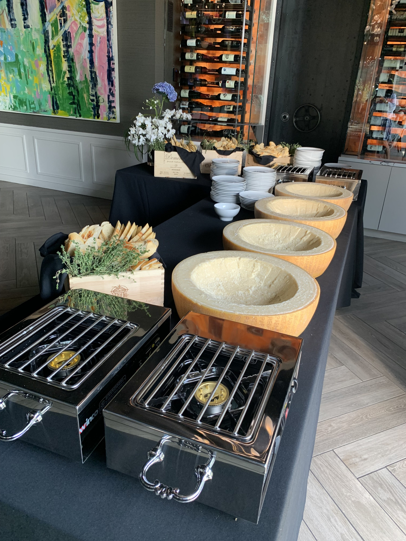 A table set with a grill and various bowls filled with food, ready for a delightful outdoor dining experience.