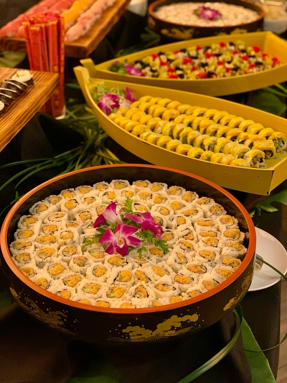 A buffet table displaying a variety of dishes, including appetizers, main courses, and desserts, inviting guests to indulge.