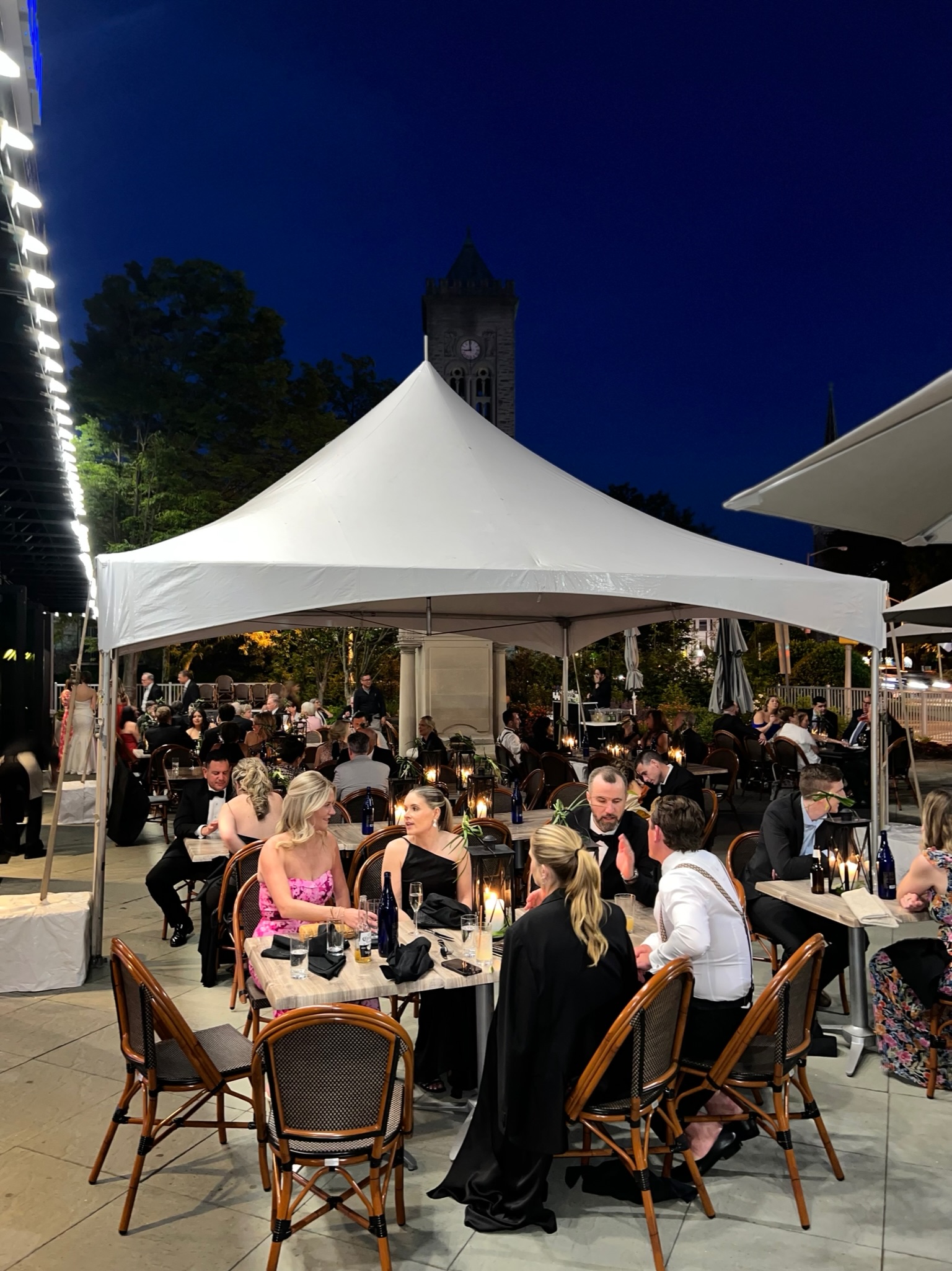 a group of people standing in front of a crowd posing for the camera
