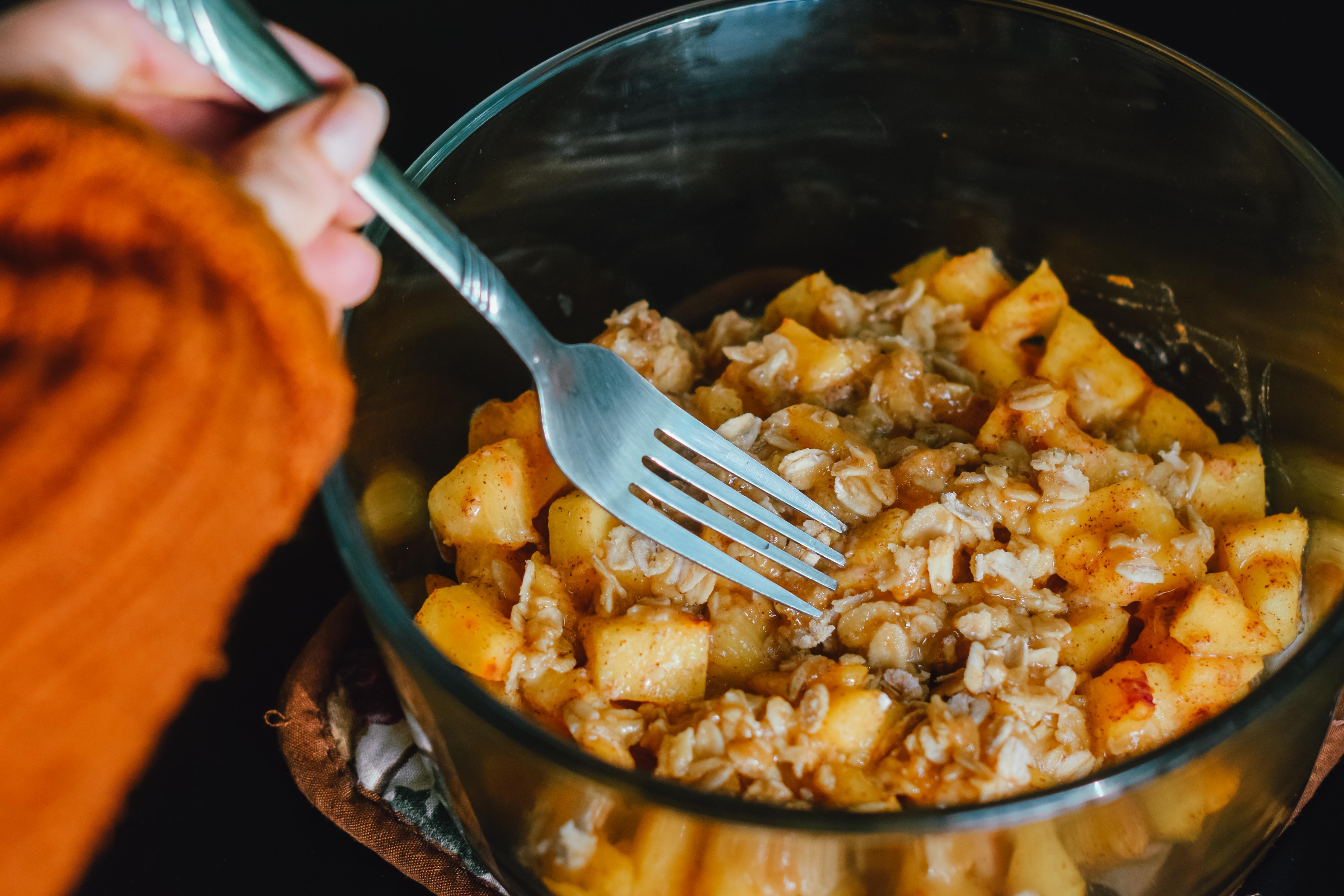 a bowl of food and a spoon