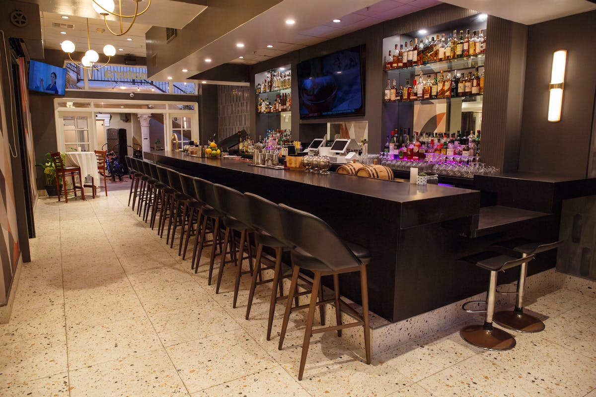 a room filled with furniture and a table in a restaurant