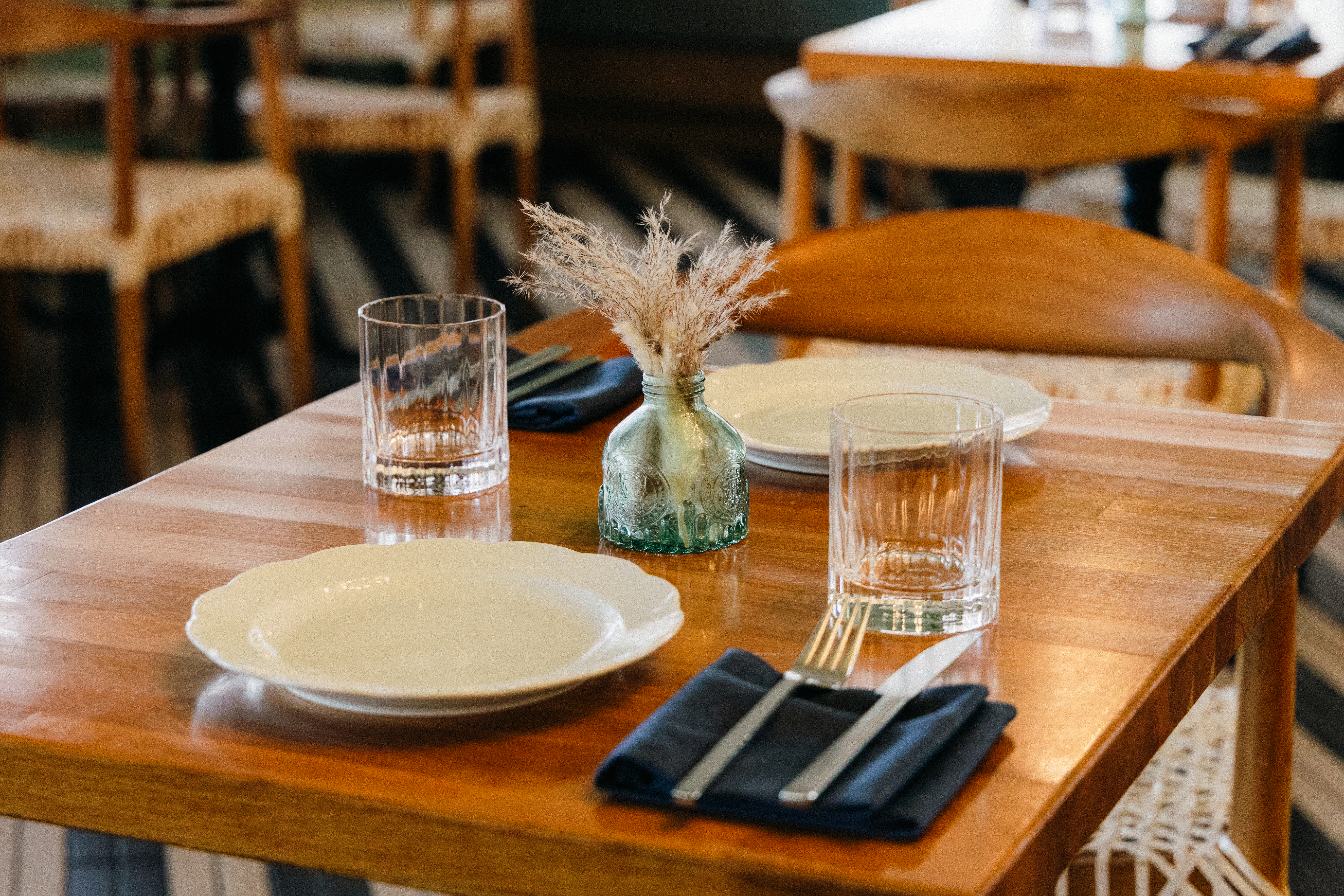 a table with plates and glasses
