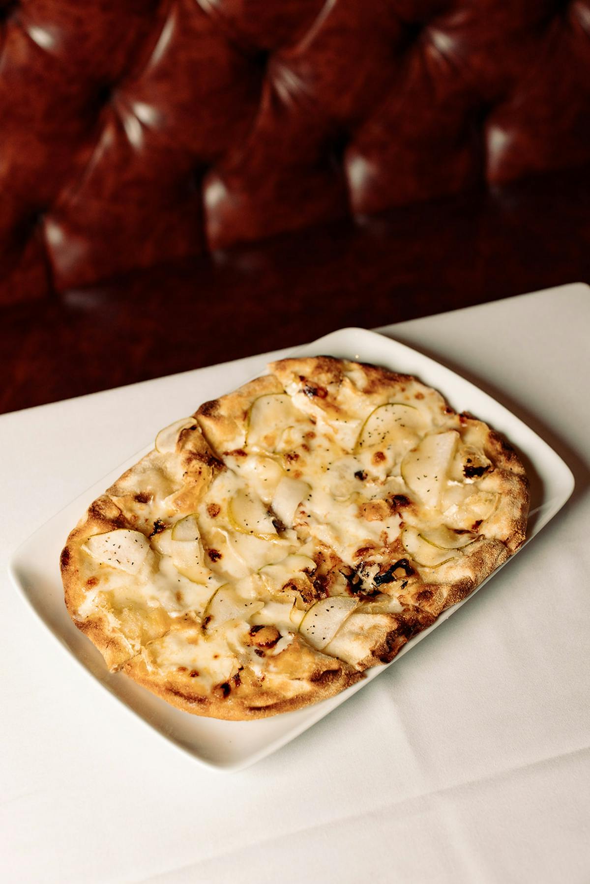 a slice of pizza on a plate