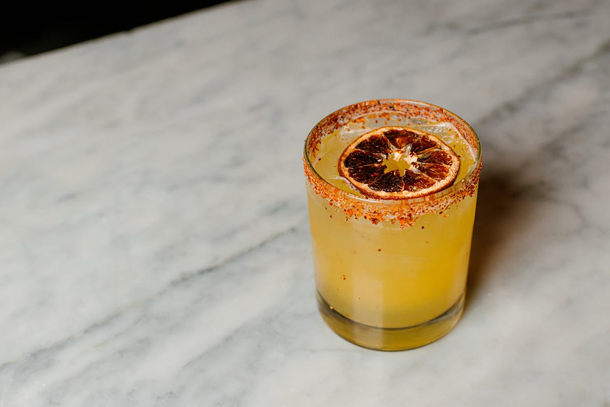 mango margerita with a fruit inside it.