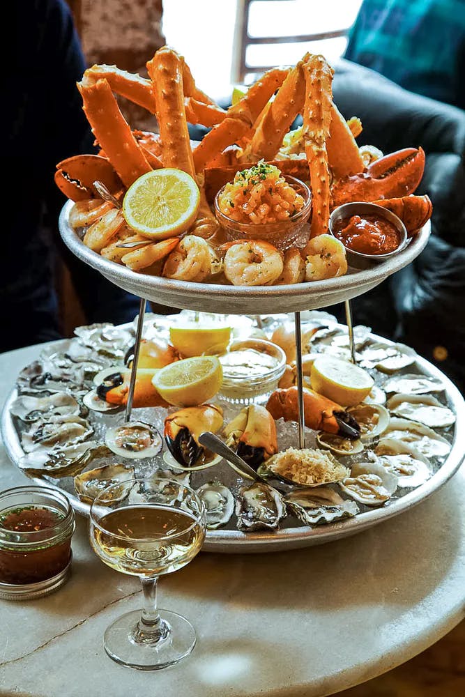 a plate full of food sitting on a table