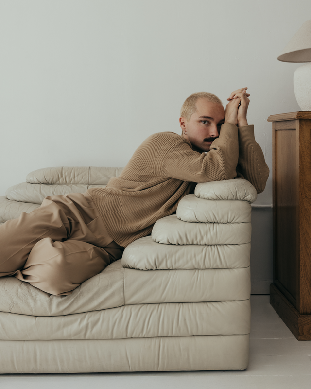 a man lying on a couch