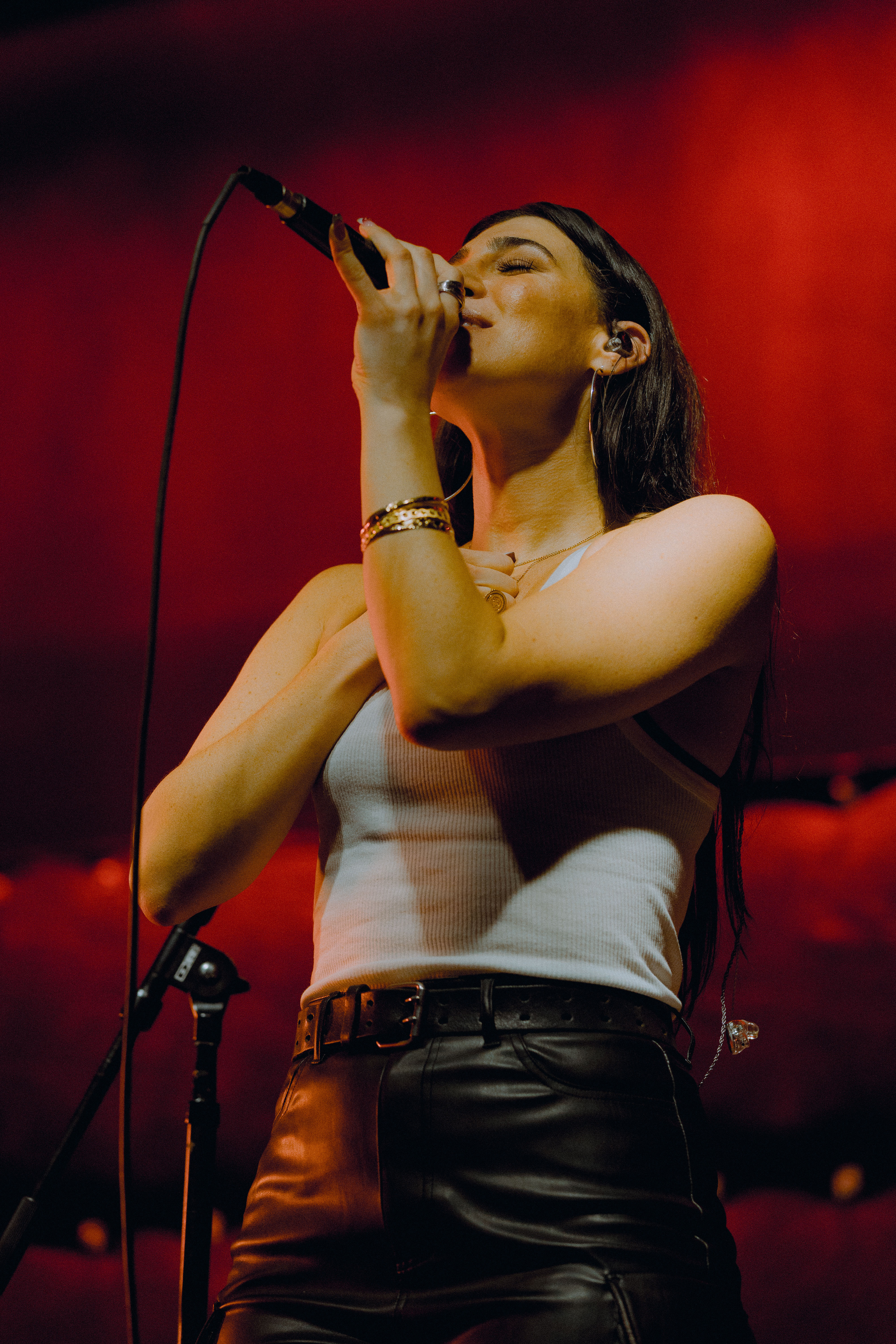 a woman singing into a microphone