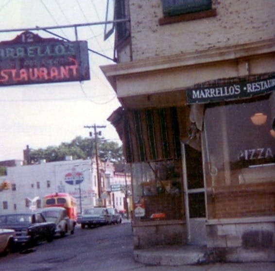 a building with a store on the side of the street