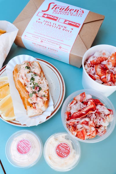 a box filled with different types of food on a plate