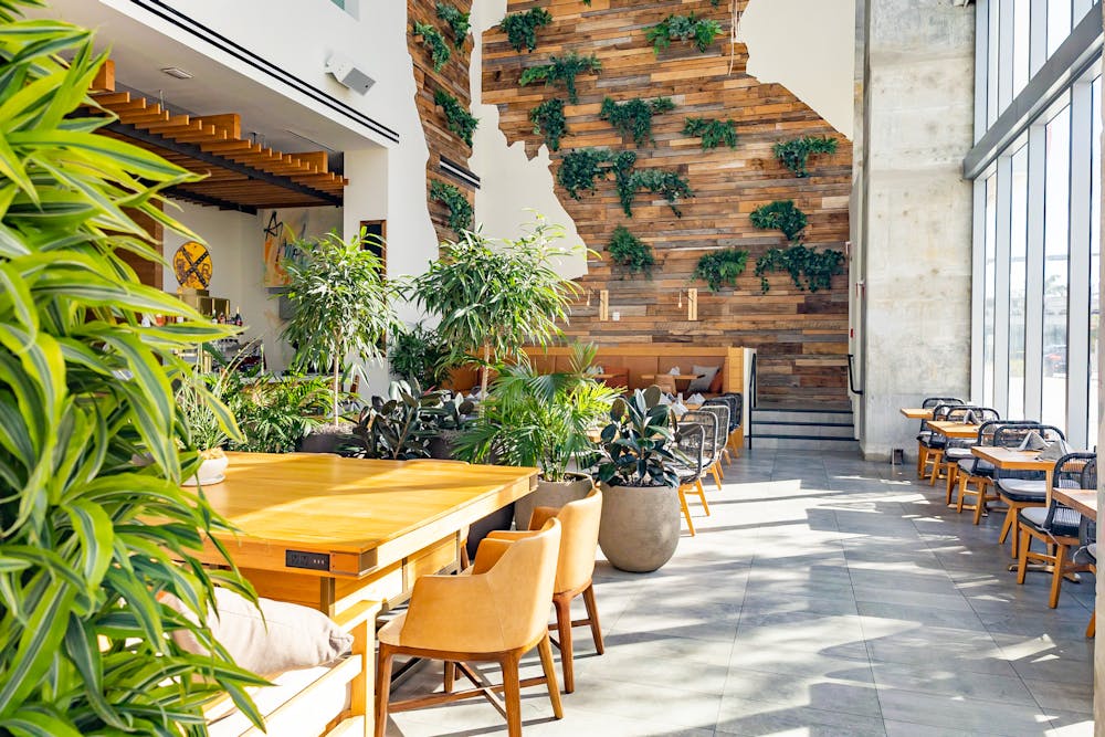 a group of people sitting at a table in front of a building