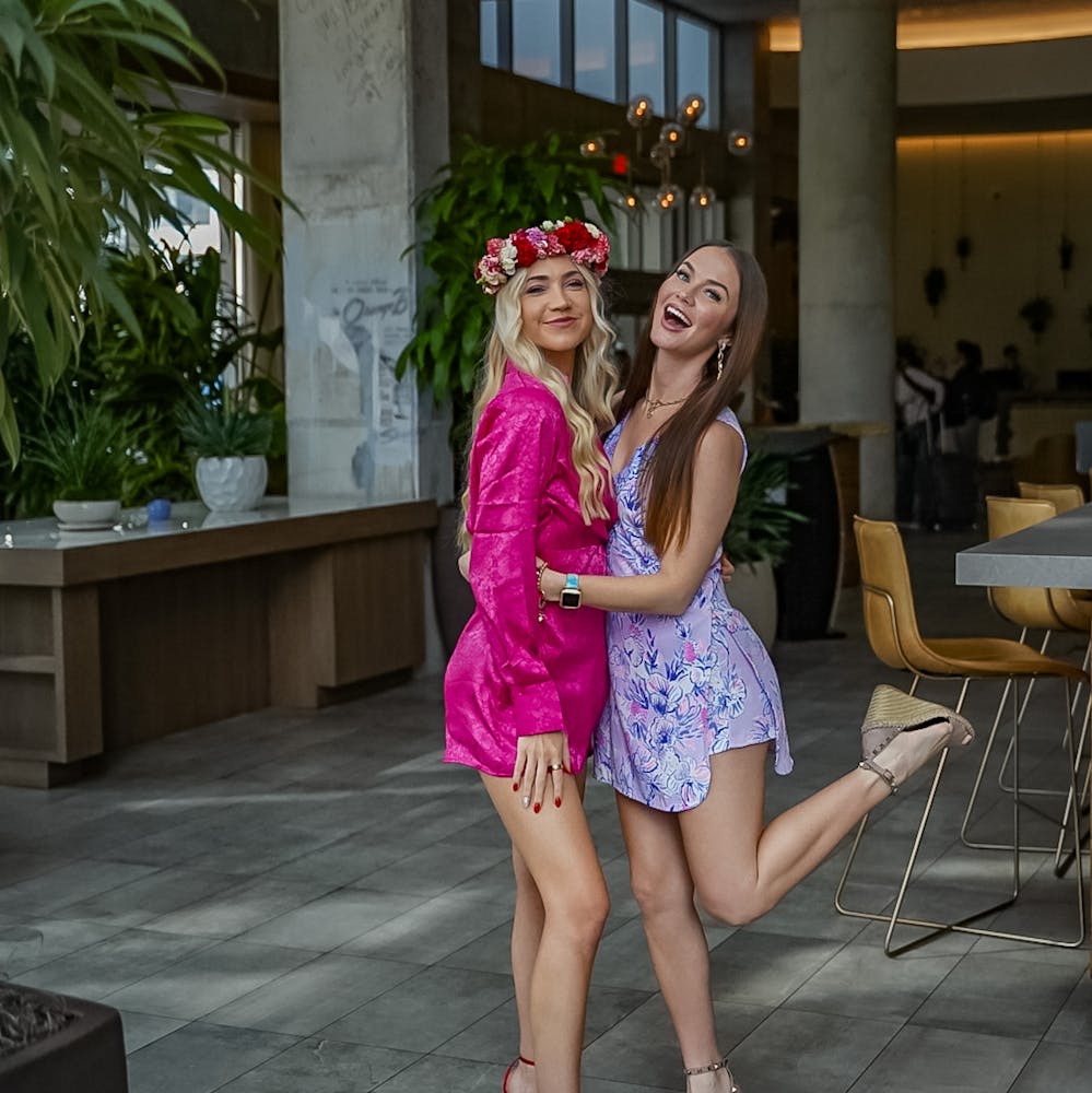 a girl standing in front of a building