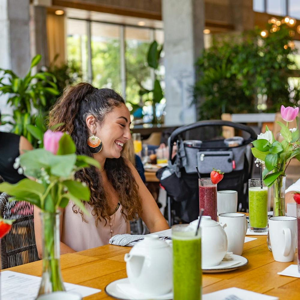 a person sitting at a table in a restaurant