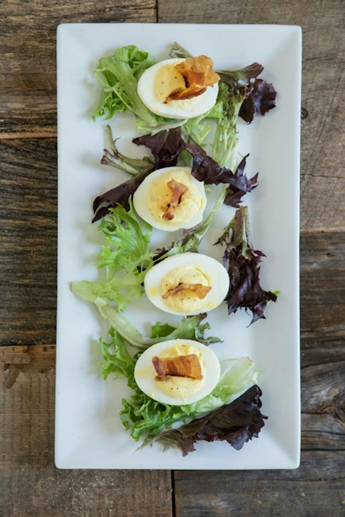 a plate of food that is on a cutting board