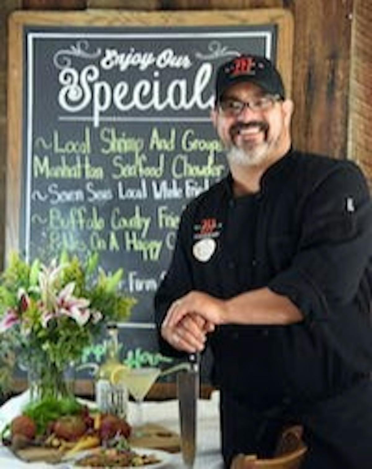 a man standing in front of a table