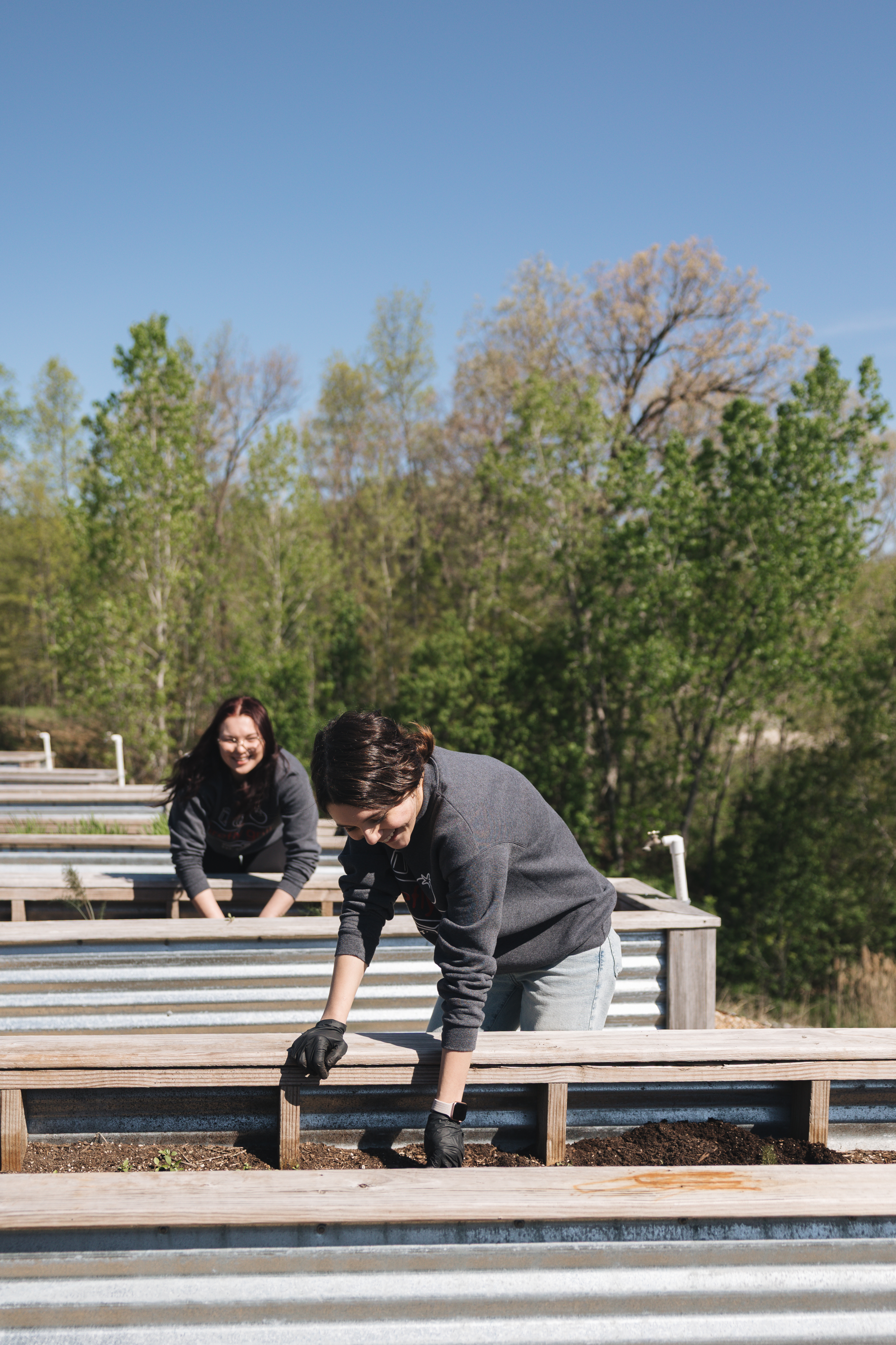 a couple of women working on a farm
