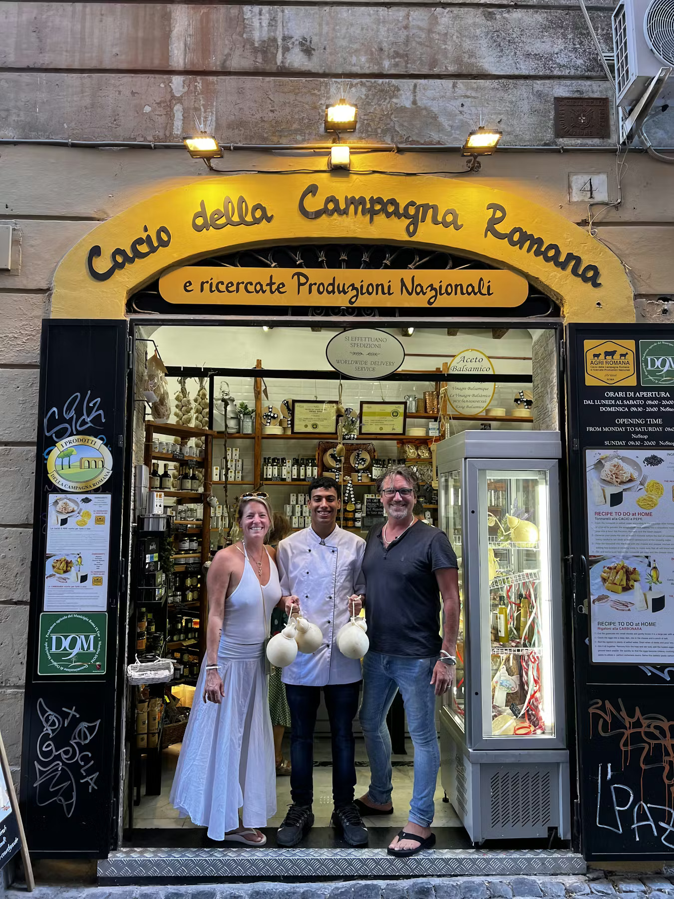 a couple of people that are standing in front of a store