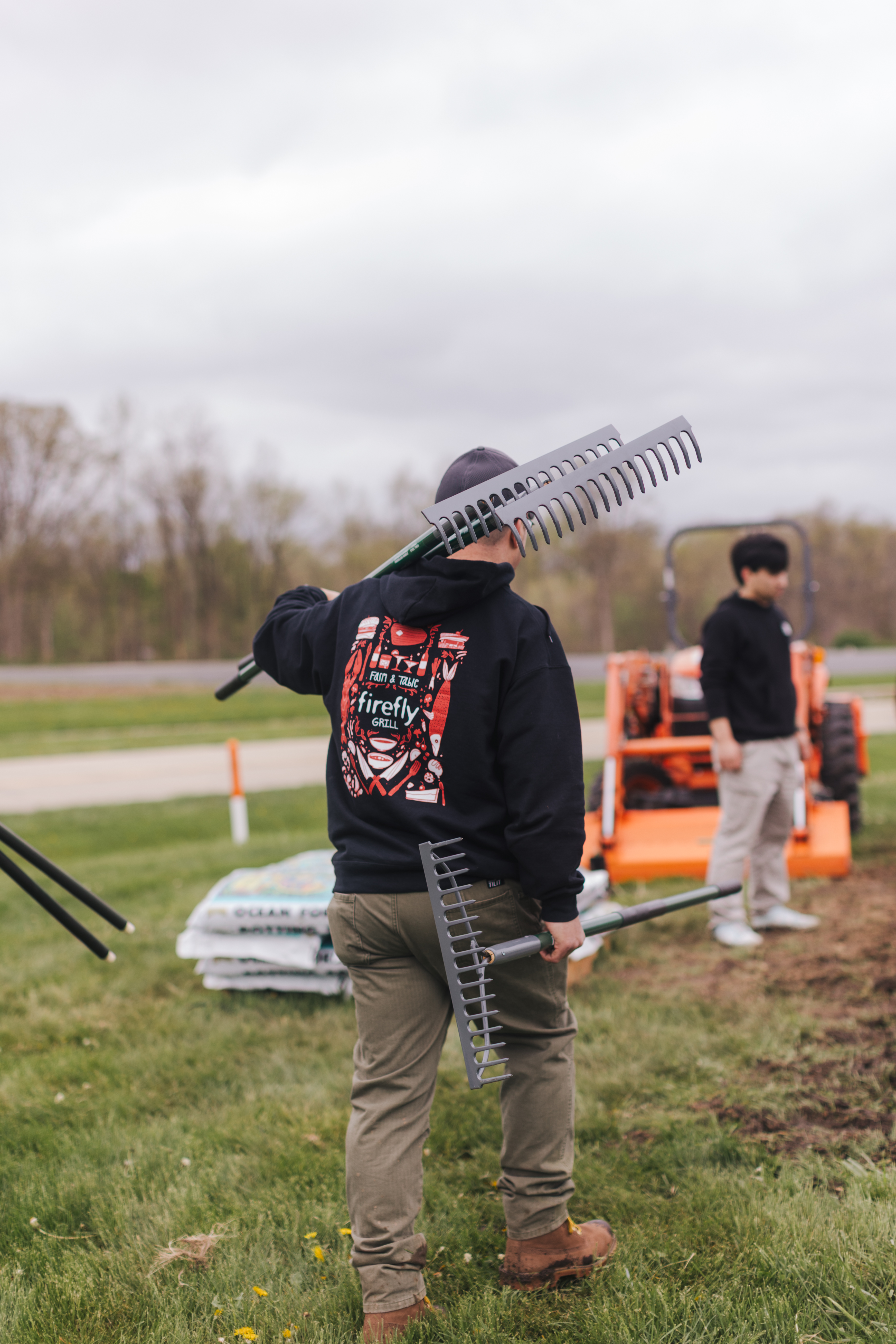 a group of baseball players standing on top of a grass covered field