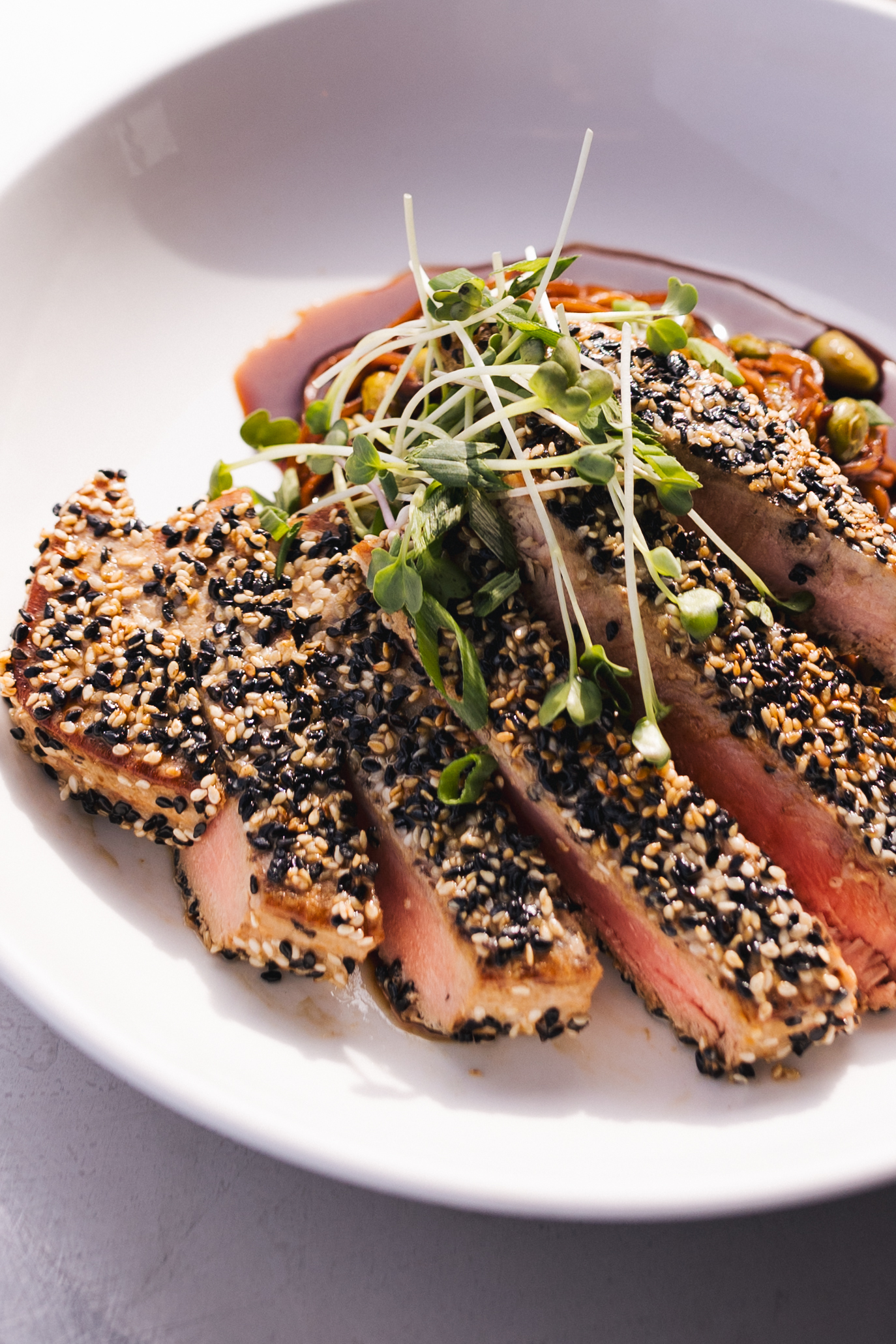 a plate of food with a sprout on top