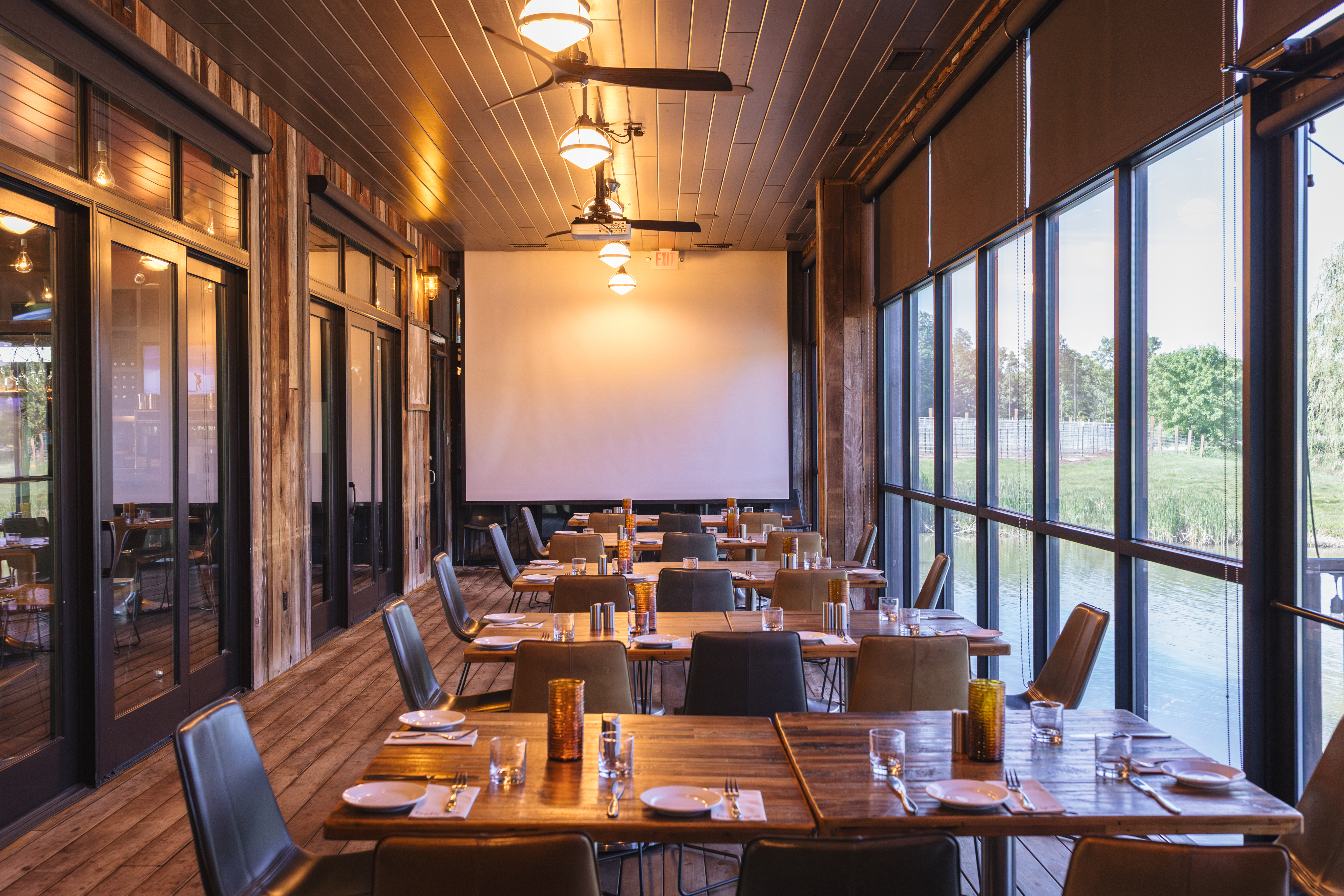 a dining room table in front of a window