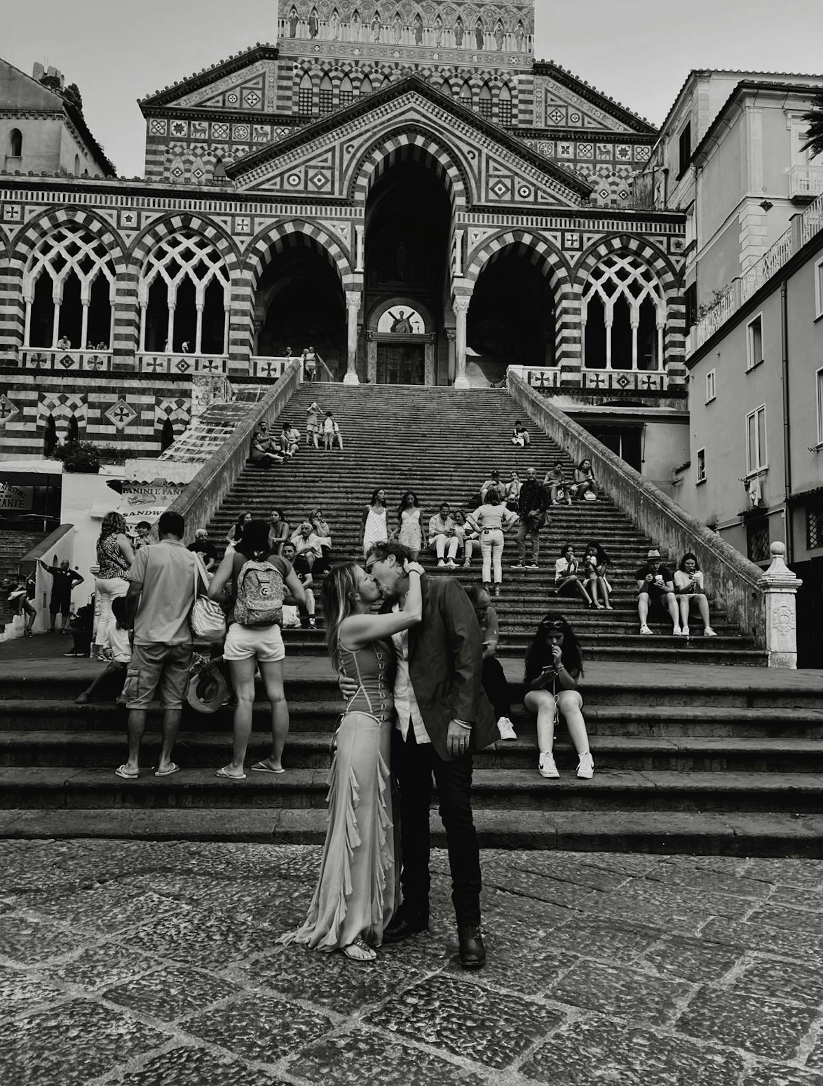 a group of people standing in front of a building