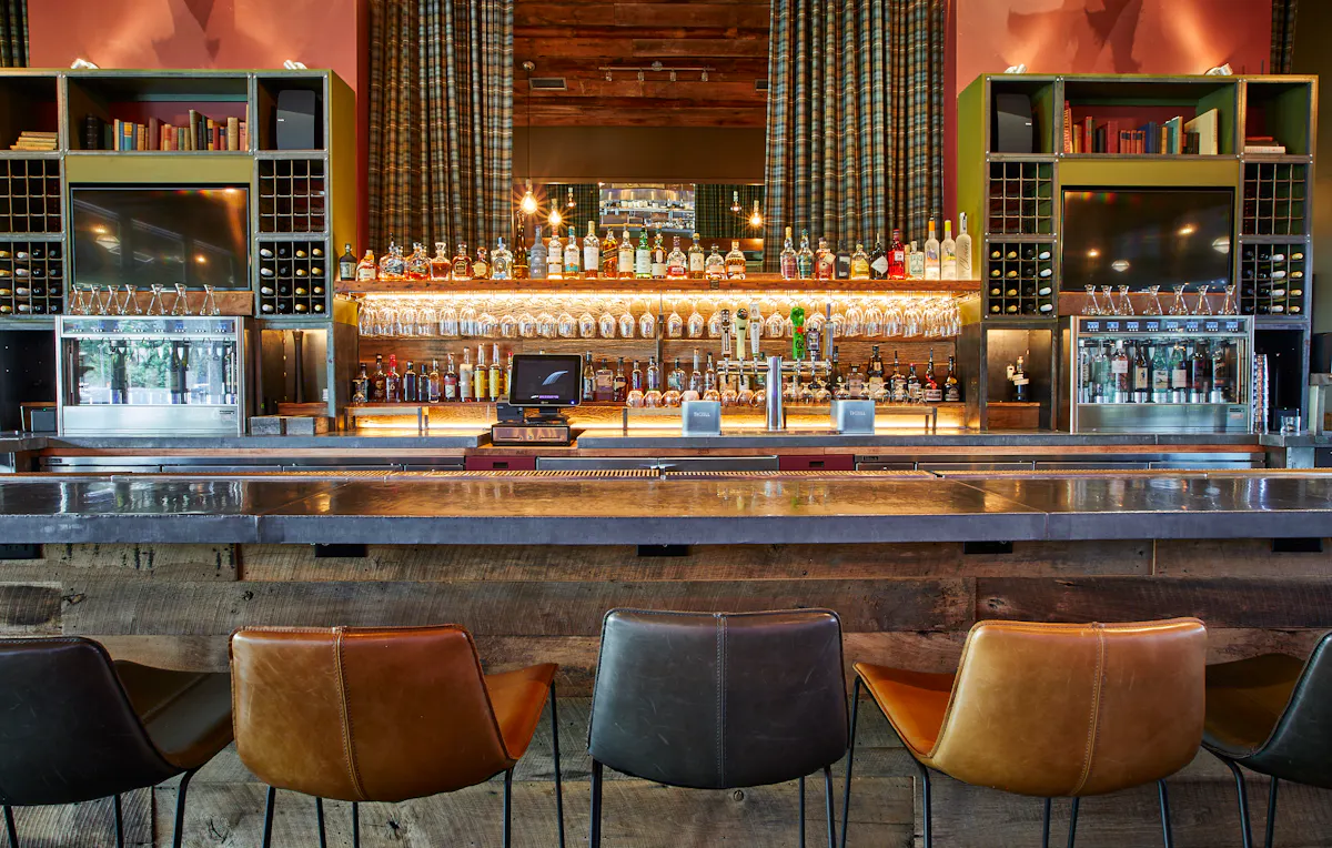 a bar with many bottles of liquor