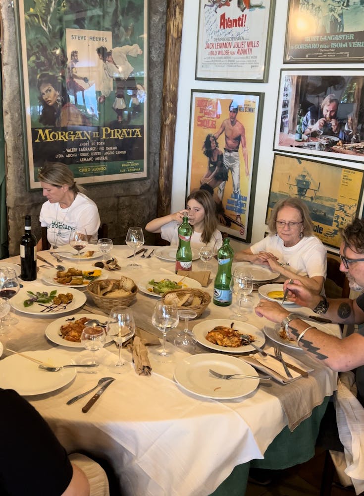 a group of people sitting at a dinner table