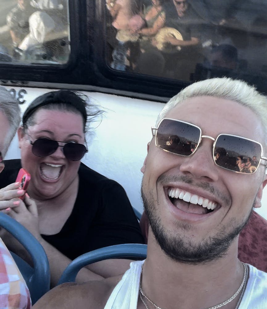 a couple of people that are wearing glasses and smiling at the camera