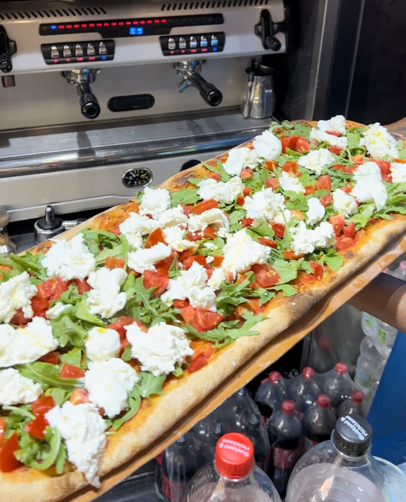 a pizza sitting on top of a counter