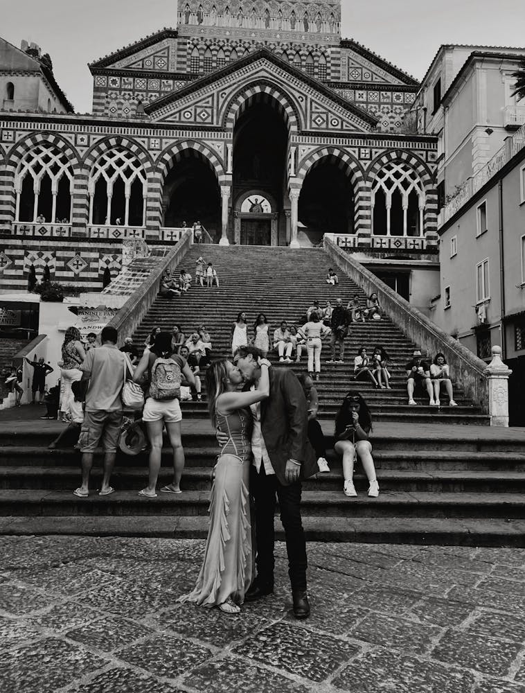 a group of people standing in front of a building