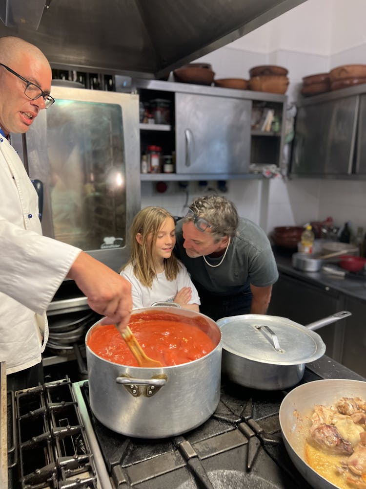 a man cooking in a kitchen preparing food