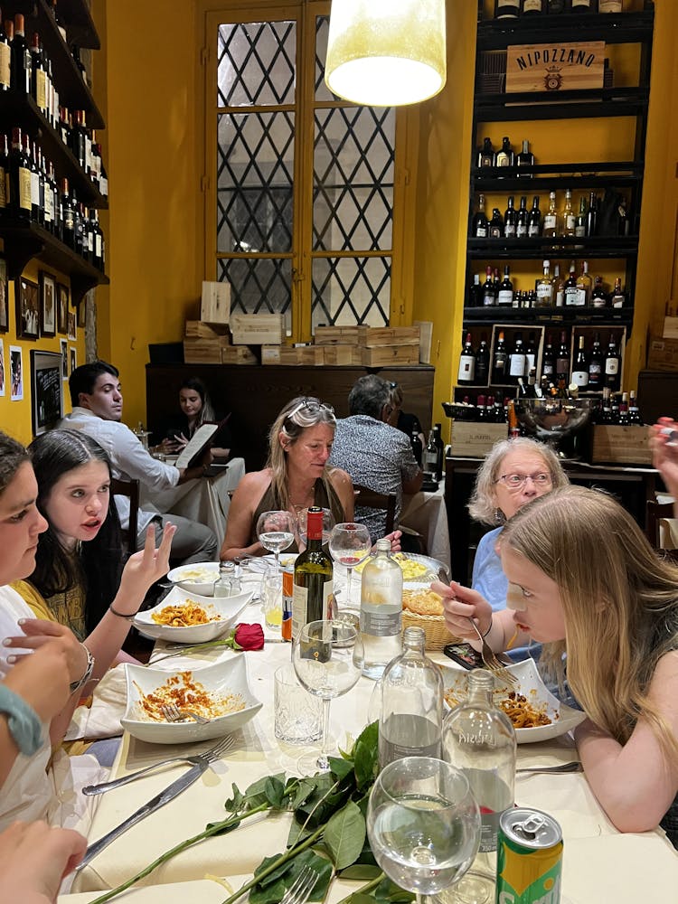 Anna Kontula et al. sitting at a table eating food