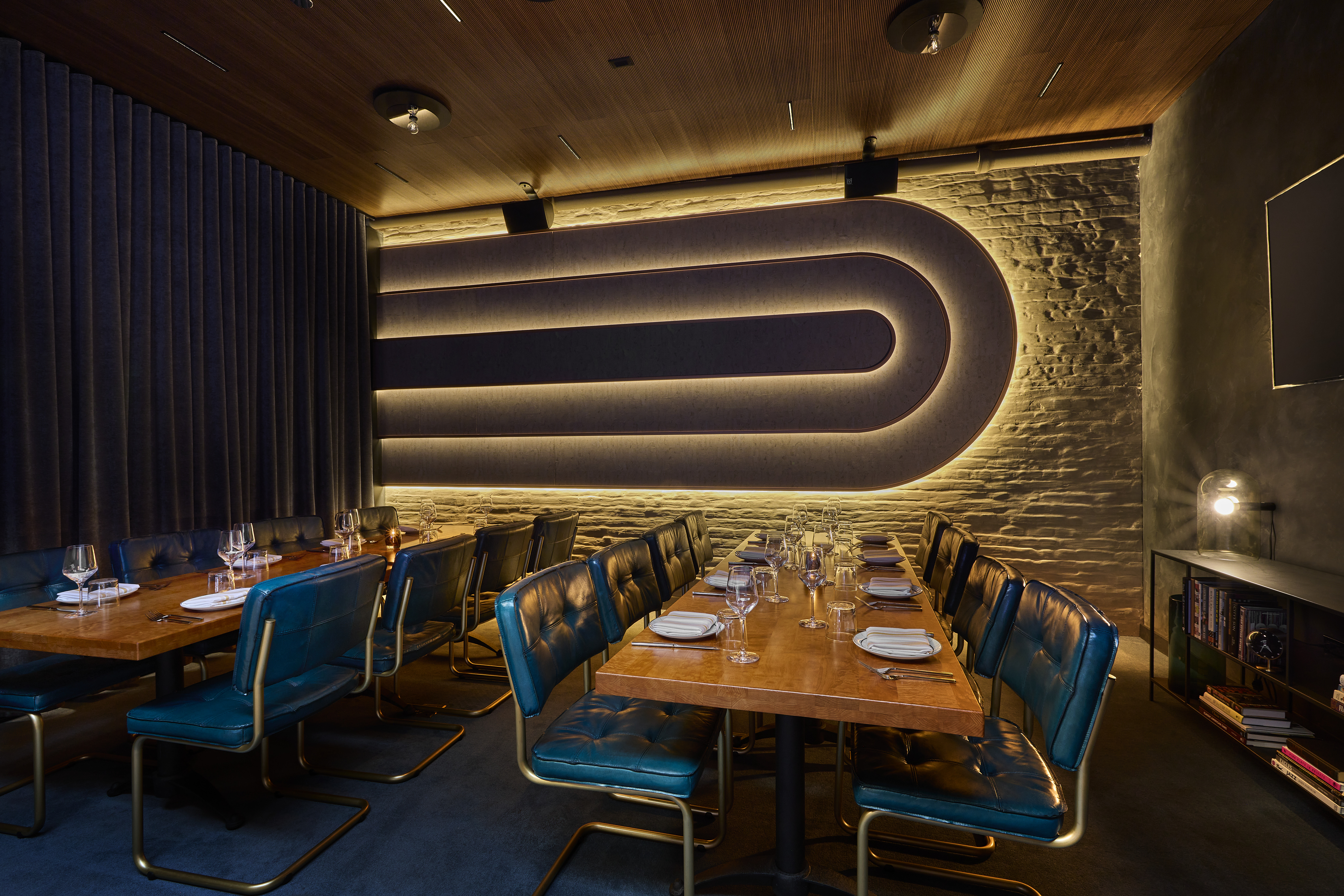 a table topped with a blue chair