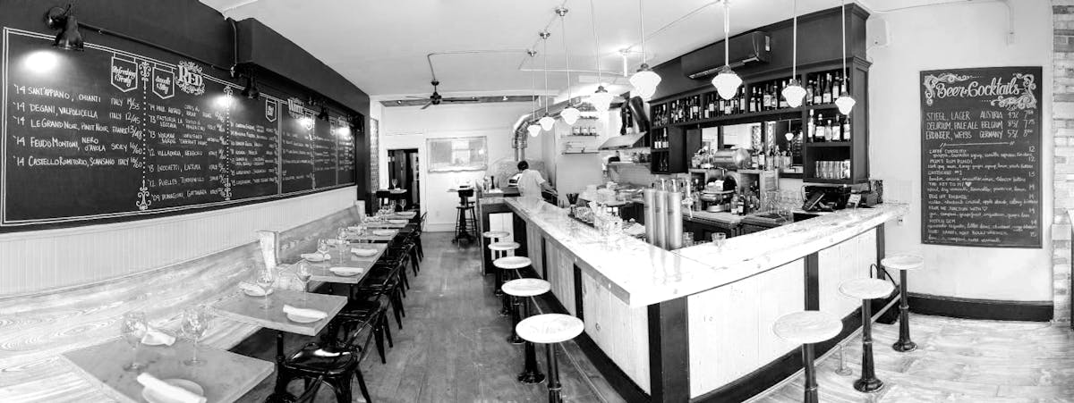 a kitchen with a table in a restaurant