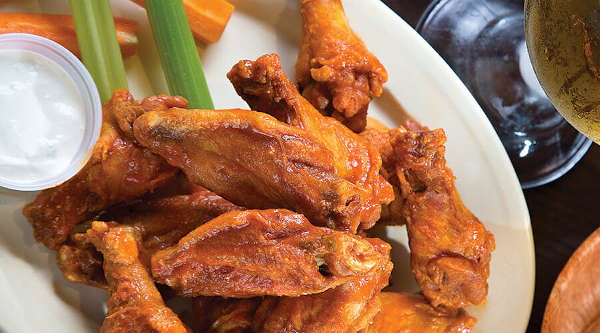a close up of chicken wings