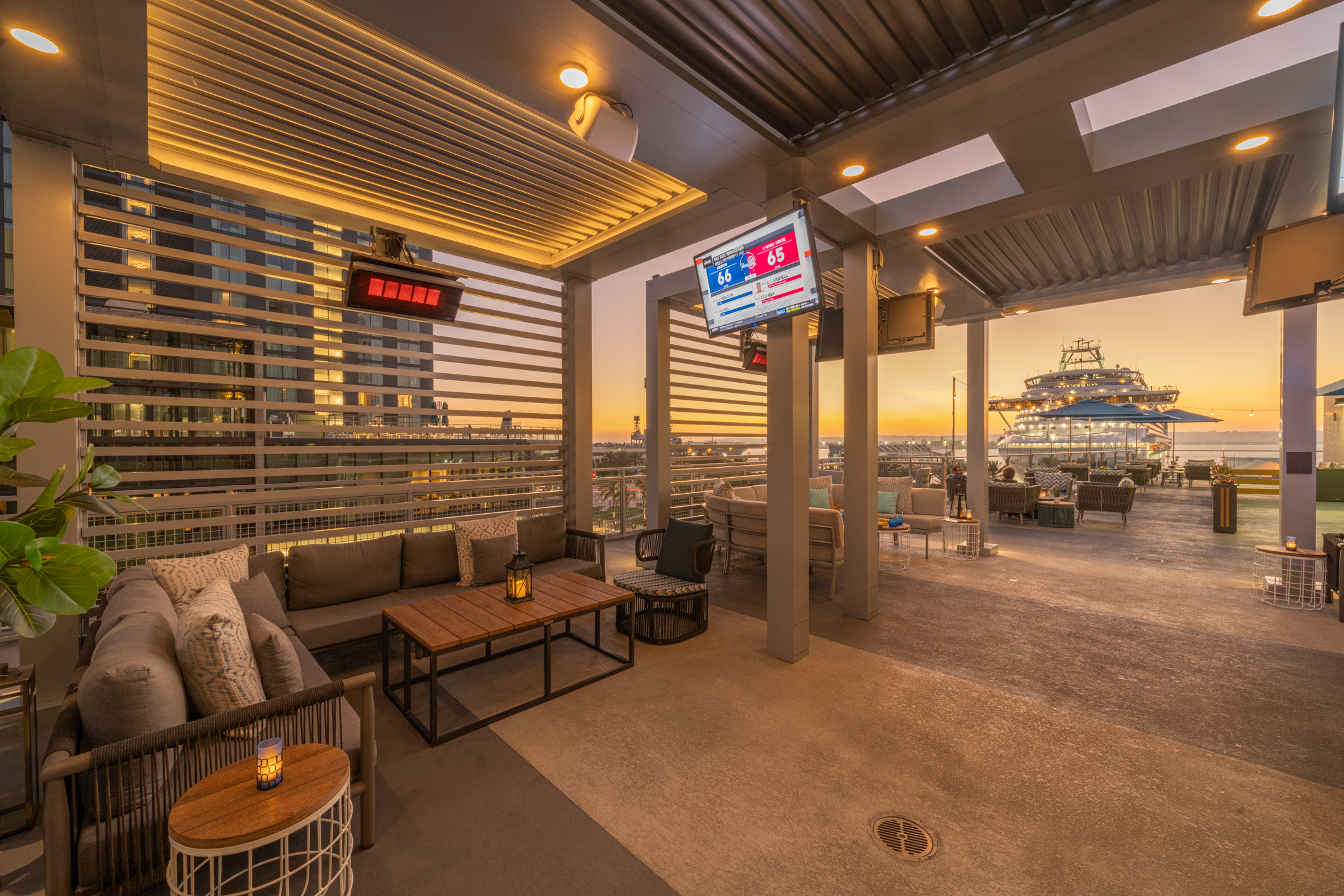 a living room filled with furniture next to a building