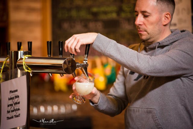 a man holding a glass of wine