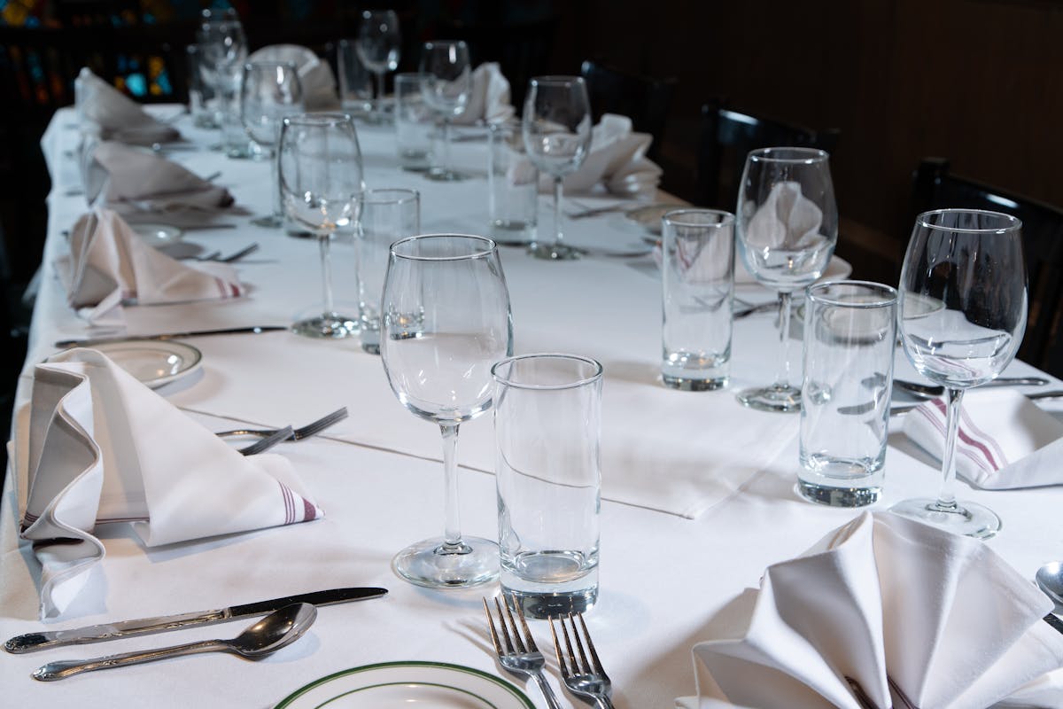 a dining table with wine glasses