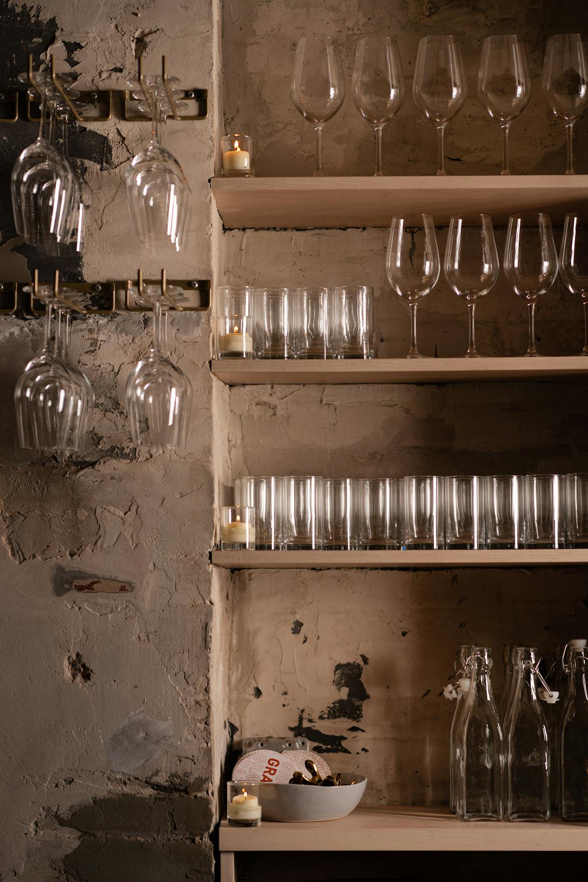 a store shelf filled with wine glasses