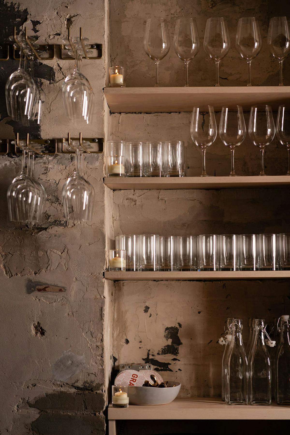 a store shelf filled with wine glasses