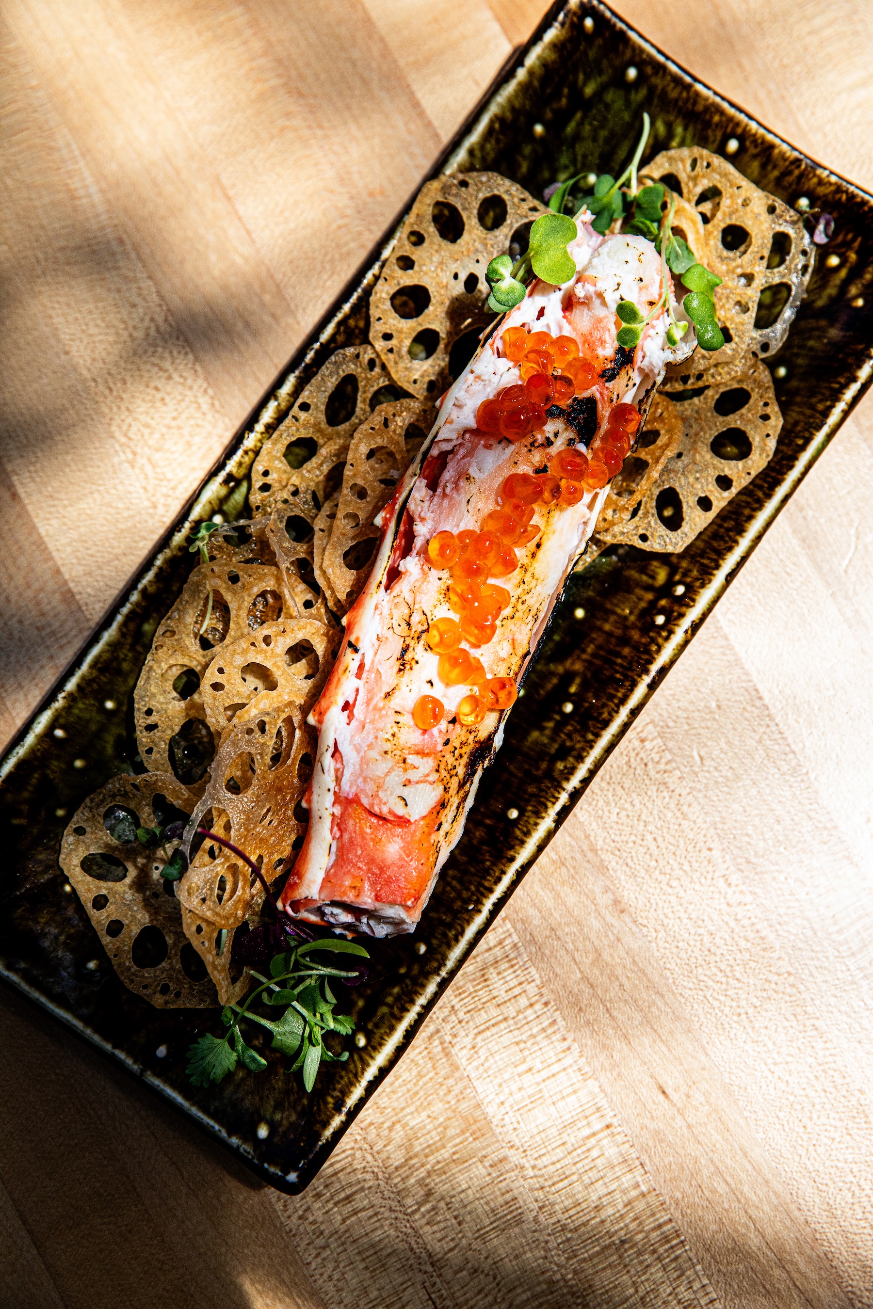 a plate of food on a wood surface