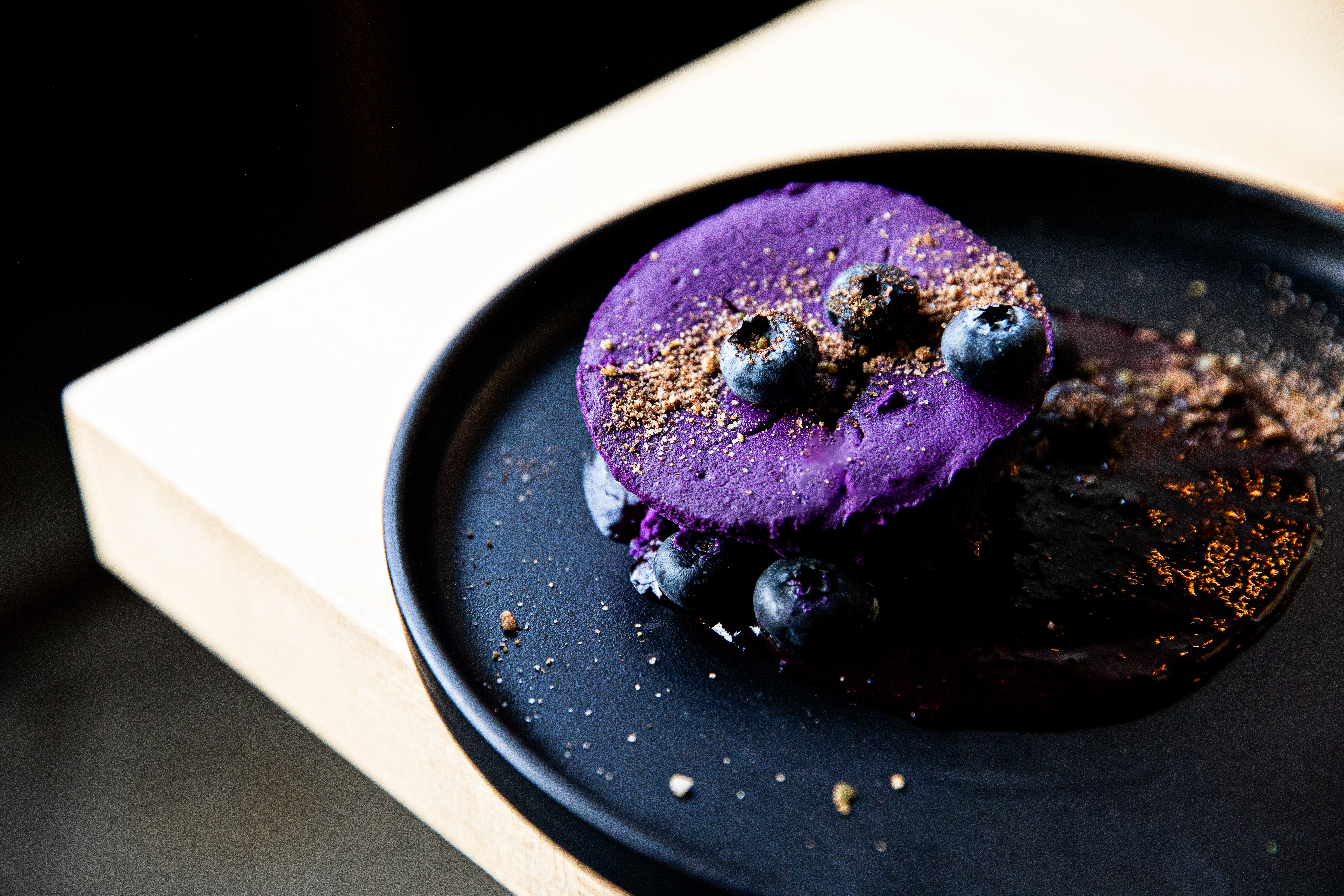 a close up of a piece of chocolate cake on a plate