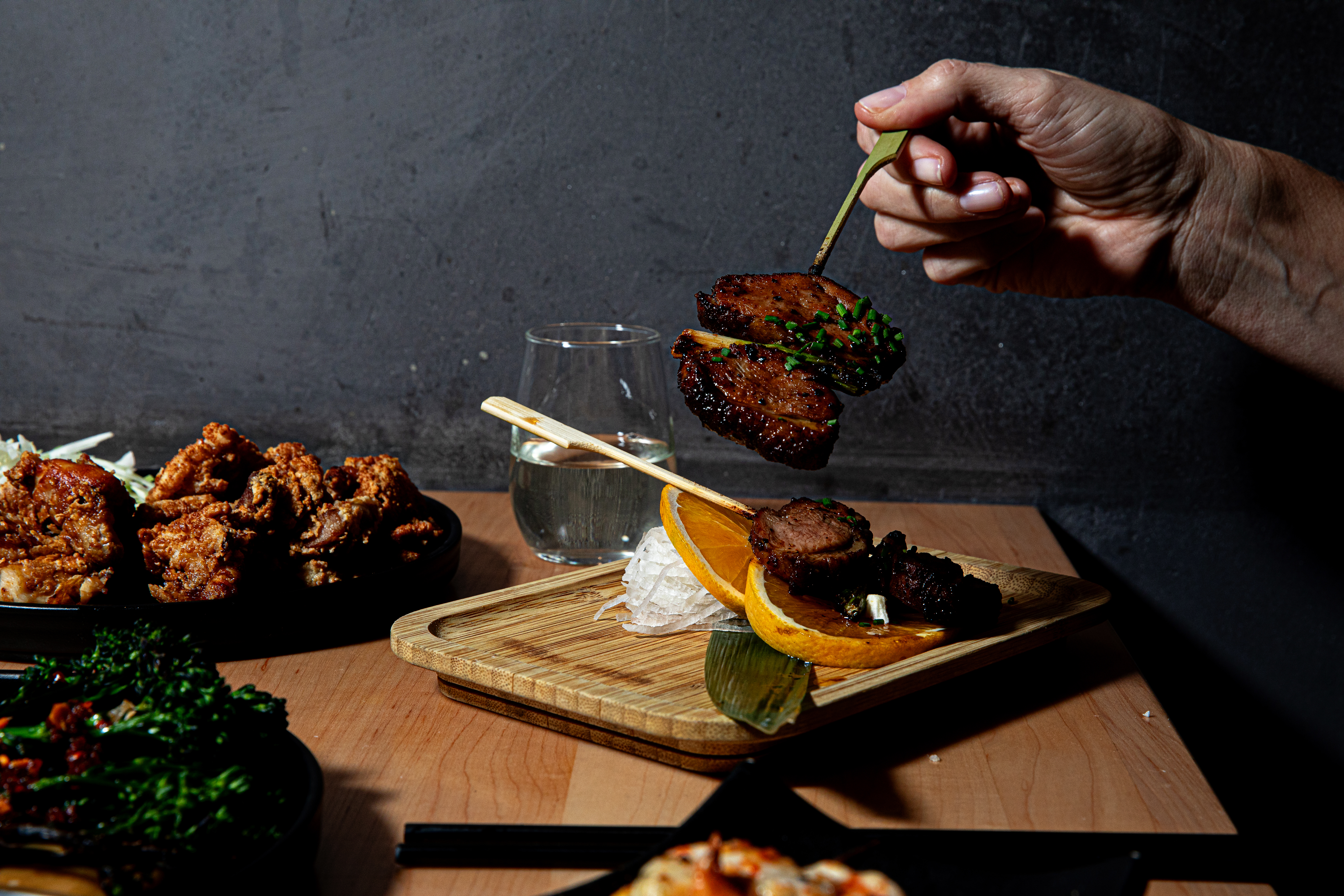 a man cutting a cake with a knife