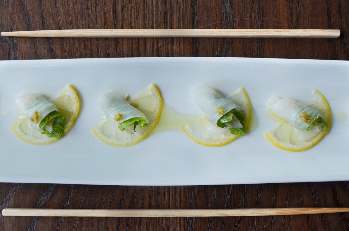 a plate of food sitting on top of a wooden table