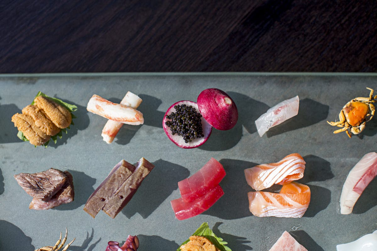 a bunch of different types of food on a table