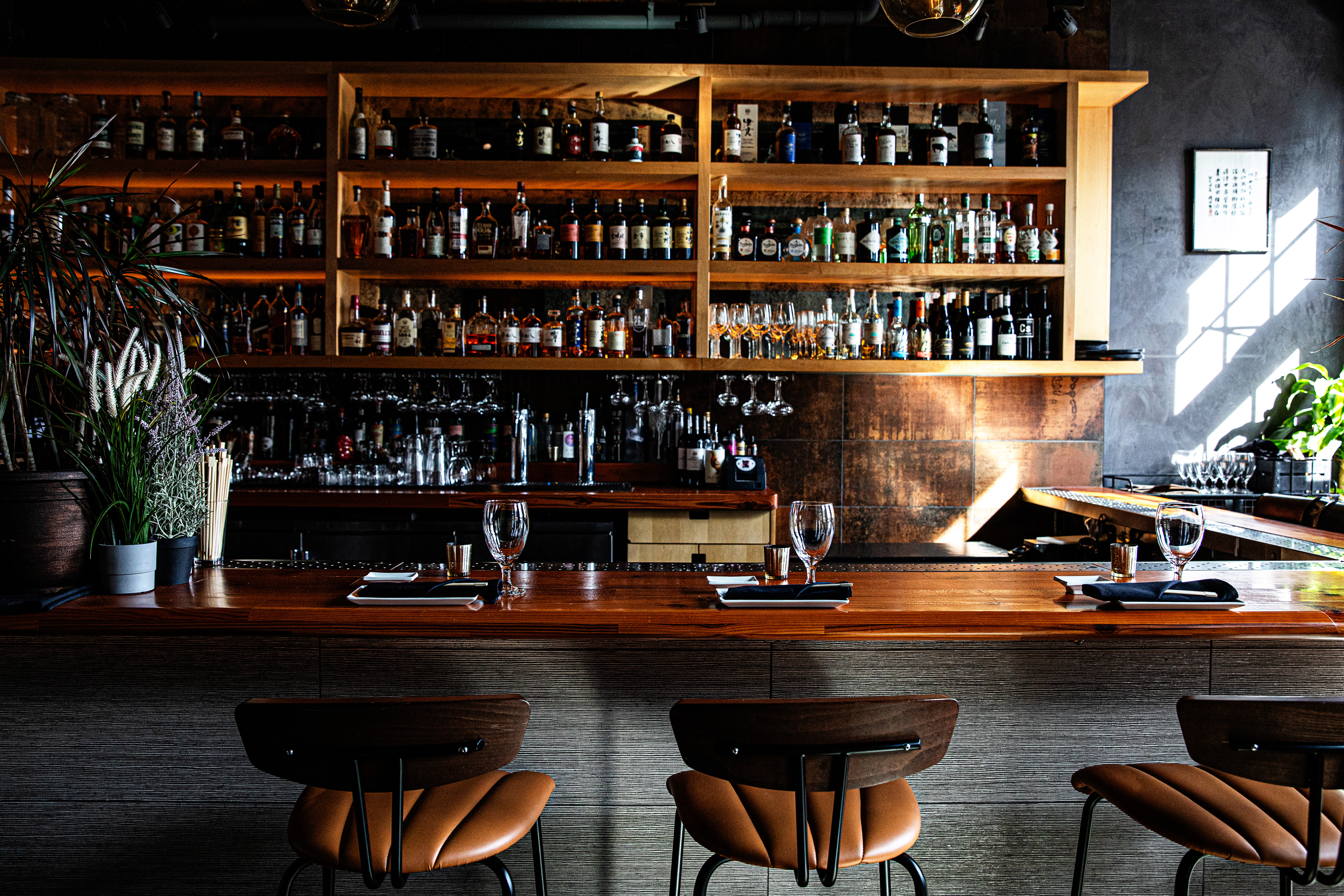 a room filled with furniture and vase on a table