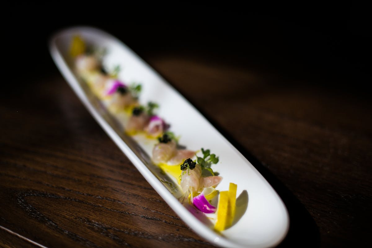 a close up of a plate of food with a knife and fork