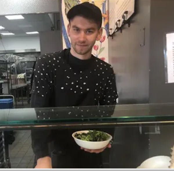 a person standing in a kitchen