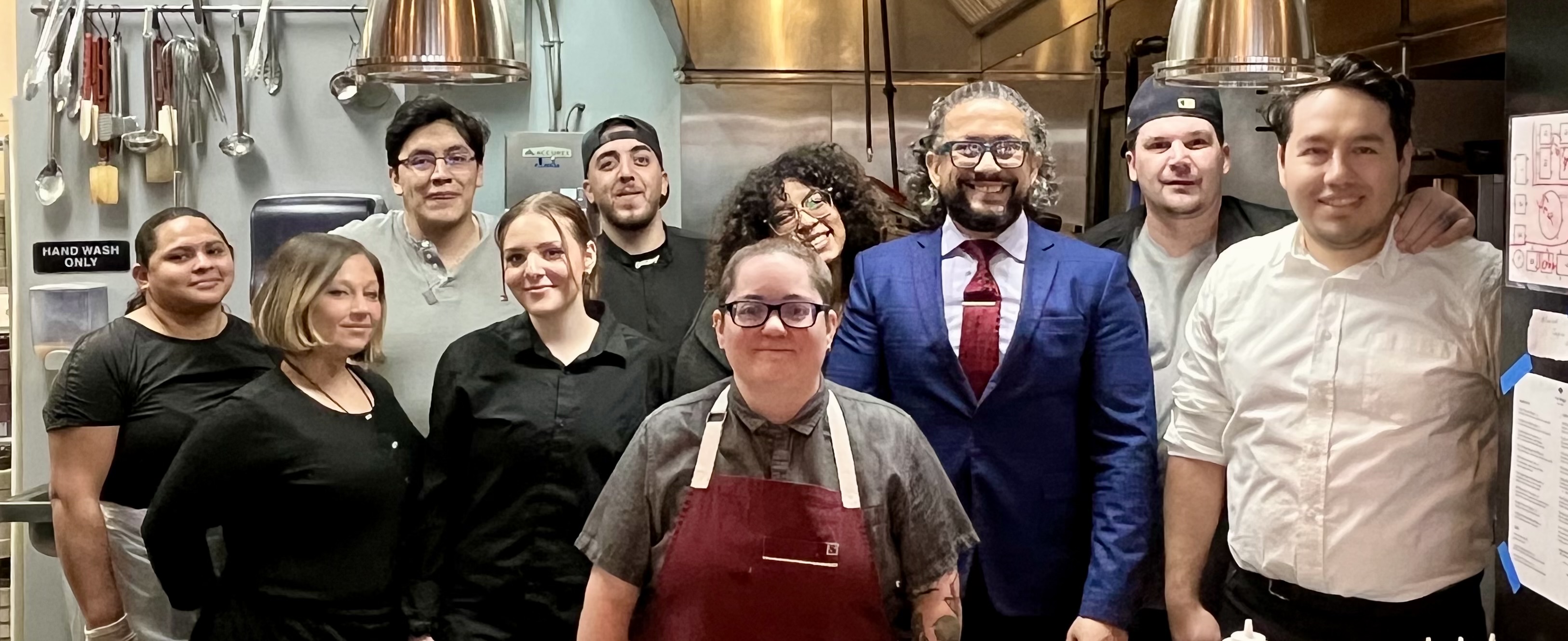 a person sitting at a table with a plate of food