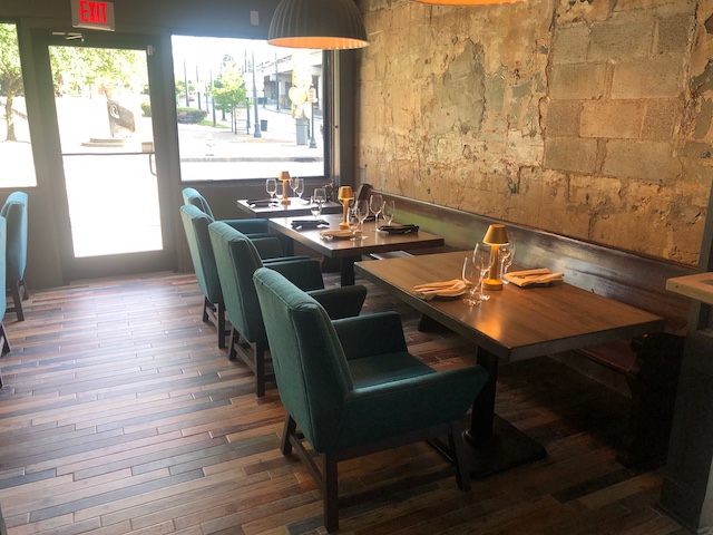 a room filled with furniture and a large window