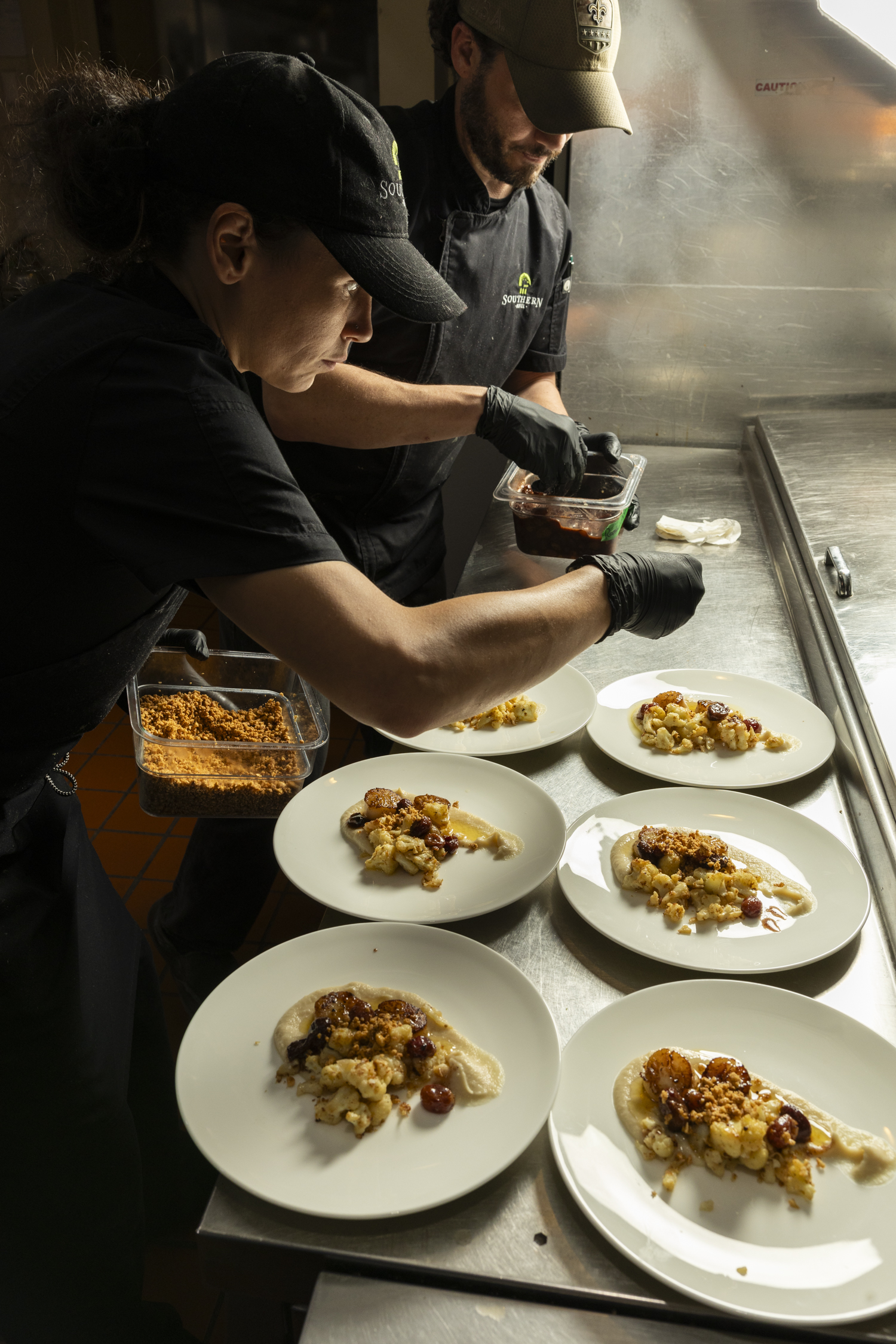 a person sitting at a table with a plate of food